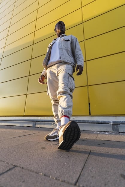 A person walking confidently in well-maintained designer sneakers on a city street, showcasing movement and lifestyle integration.