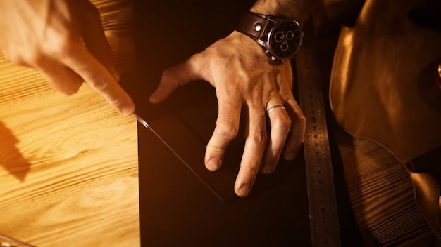 A professional shoemaker meticulously inspecting a piece of supple, dark brown nubuck, showcasing the fine, brushed texture under focused workshop lighting.