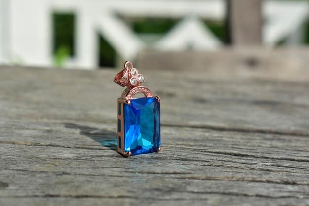 A close-up of an intricately detailed vintage-inspired cocktail ring featuring an emerald-cut deep blue simulated sapphire surrounded by tiny sparkling cubic zirconia, set in antique silver, resting on a velvet cushion.