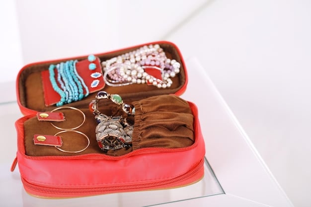 A close-up view of various fashion jewelry pieces neatly organized in a compact travel jewelry case, with individual compartments for rings, earrings, and necklaces.