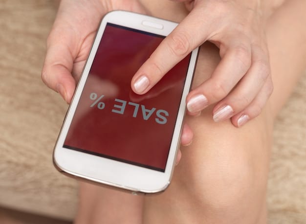 A close-up shot of a smartphone screen displaying a price comparison app during outlet shopping, showing a discounted item's price versus its original retail price, emphasizing smart shopping and digital tools.