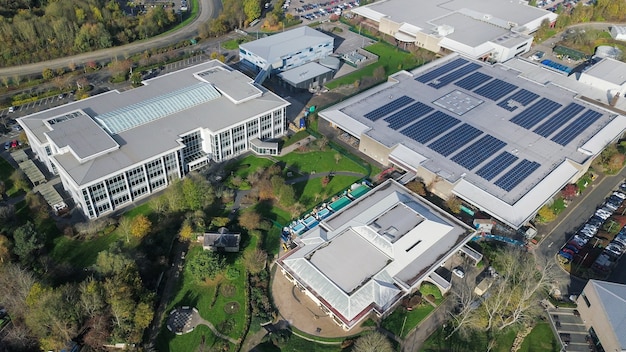A factory roof covered with solar panels, demonstrating a commitment to renewable energy and sustainable manufacturing practices.