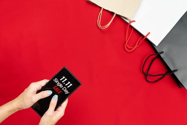A close-up of a hand holding a smartphone displaying various digital coupons, with designer shopping bags blurred in the background.