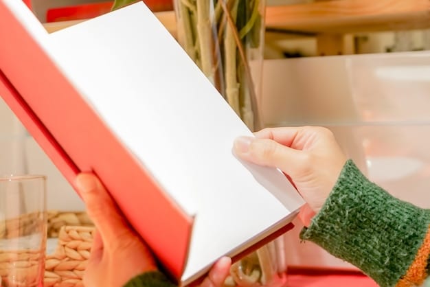 A person's hand holding an outlet mall coupon book, open to a page with various store discounts, with a clear focus on the coupons.