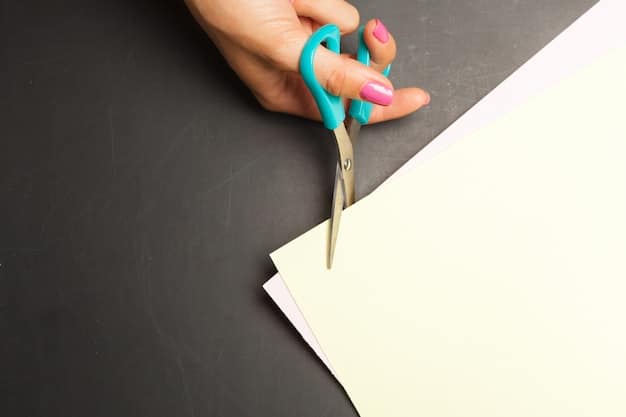 A close-up of a hand deftly using a small pair of scissors to snip a loose thread from a delicate fabric, illustrating precision and care.