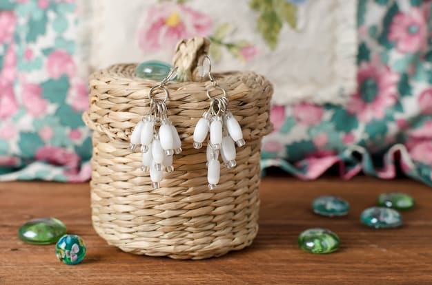 A detailed shot of an intricately woven straw tote bag adorned with oversized wooden beads and a delicate, hand-stitched floral emblem, casually propped against a whitewashed wall.